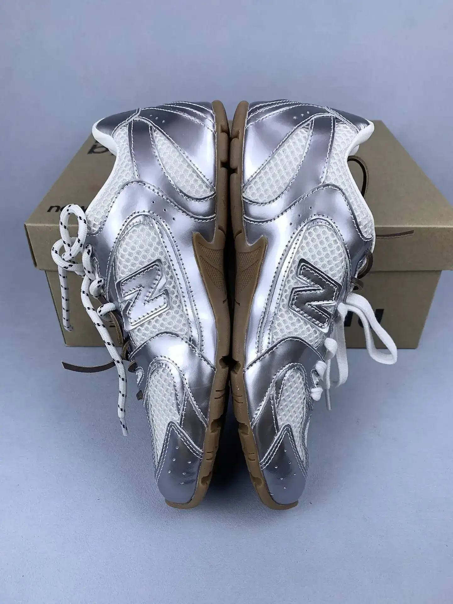 New Balance X Miu Miu 530 SL metallic leather and mesh sneakers product photo from LabelPicks