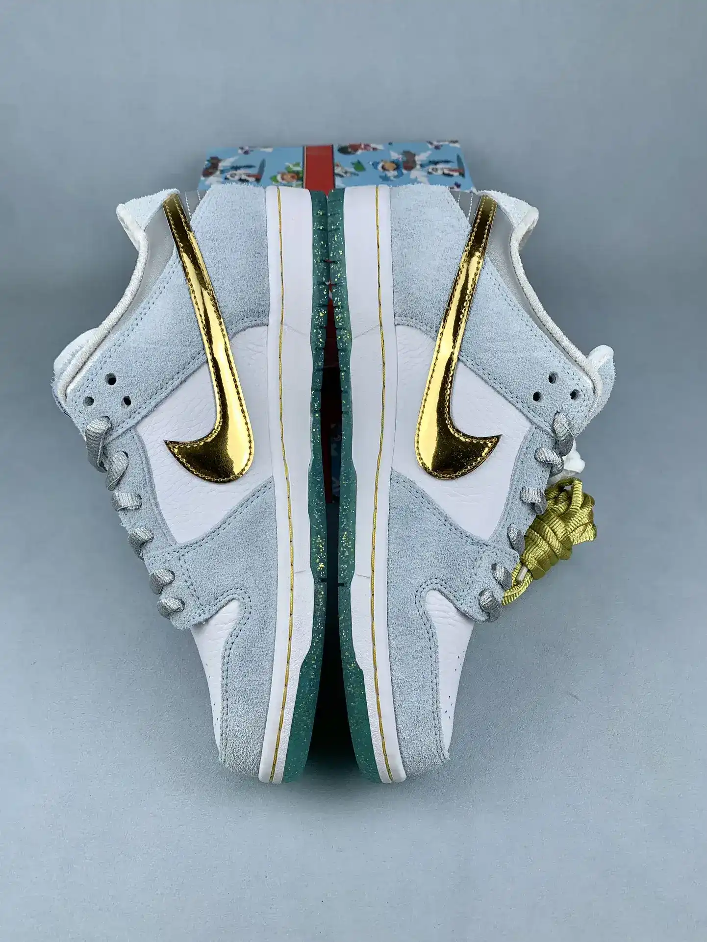 Sean Cliver x Nike SB Dunk Low Pro QS “Holiday Special” - White/Psychic Blue/Metallic Gold product photo from LabelPicks