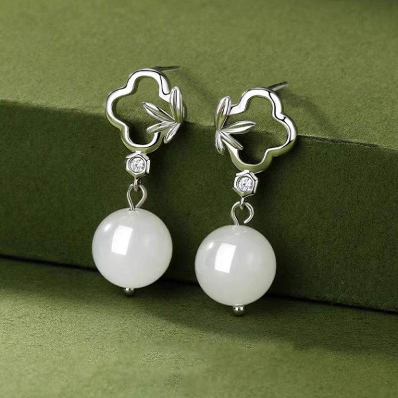 S925 sterling silver four-leaf clover earrings, featuring a new Chinese-style, artistic, and retro design with white jade pendants, creating a light luxury and elegant look