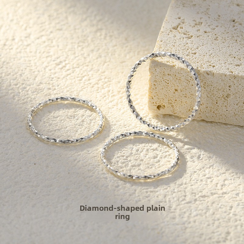 999 pure silver sparkling starry sky ring for women, featuring an intricate floral design, a shimmering sand-like finish, a simple band, and a closed diamond-shaped ring for the index finger