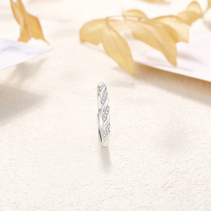 s925 sterling silver, a pair of rings with a romantic and intertwined design, featuring a unique twist pattern, exuding a sophisticated and trendy aesthetic