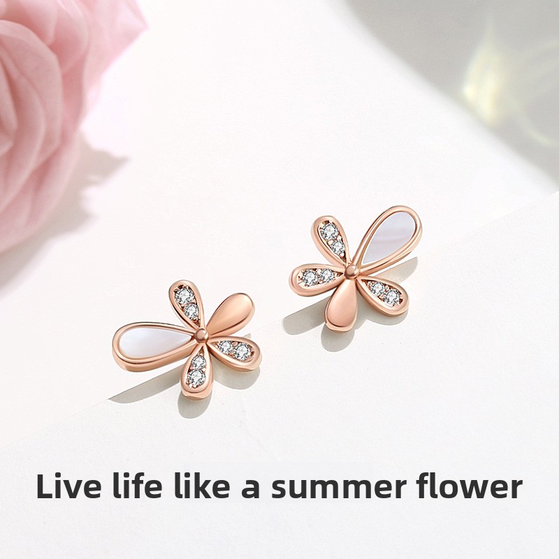 S925 sterling silver Korean-style floral earrings, small and delicate, popular among influencers, with a minimalist and fresh aesthetic, featuring mother-of-pearl accents