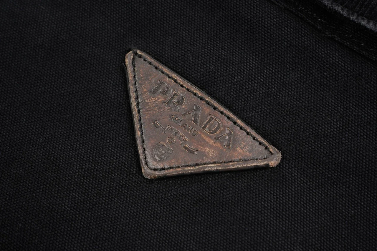 Prada Black Distressed Padded Jacket with Back Triangle Leather Patch product photo from LabelPicks