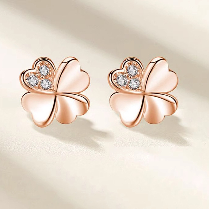 Four-leaf clover earrings, made of 999 pure silver, Korean style, minimalist design, forest-themed, heart-shaped, trendy geometric leaf design, Instagram-style earrings