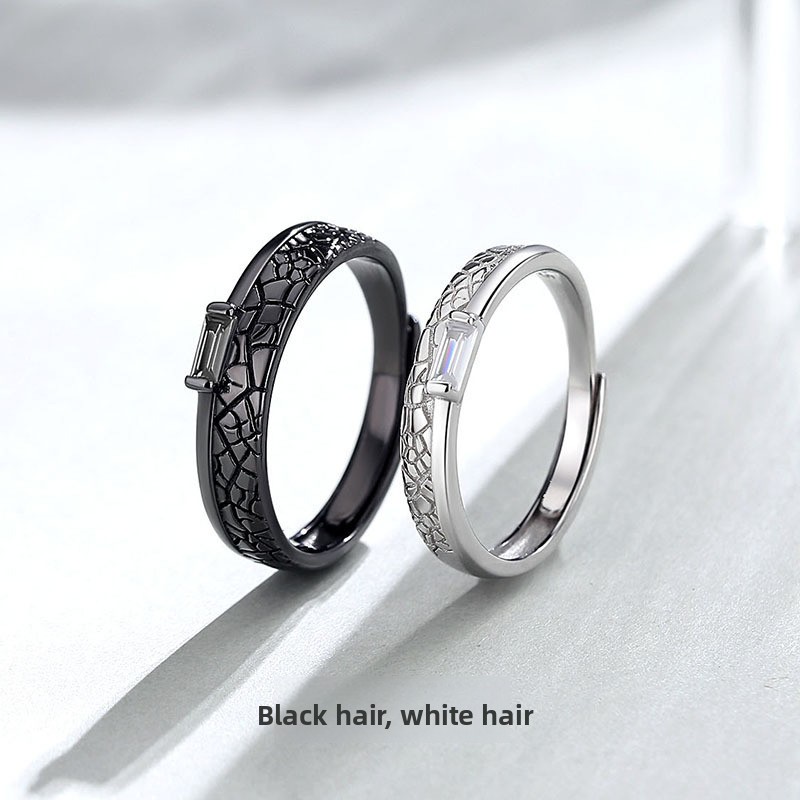 Original design: a pair of rings featuring black and white diamond patterns, perfect for couples with contrasting hair colors, a trendy and unique design inspired by Instagram aesthetics