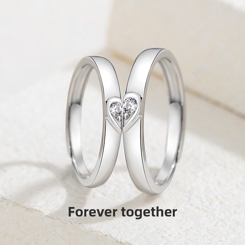 S925 sterling silver, a pair of matching rings symbolizing eternal love, with delicate inlay and a simple, plain design, featuring a heart-shaped ring, suitable for both men and women, in the trendy Instagram style