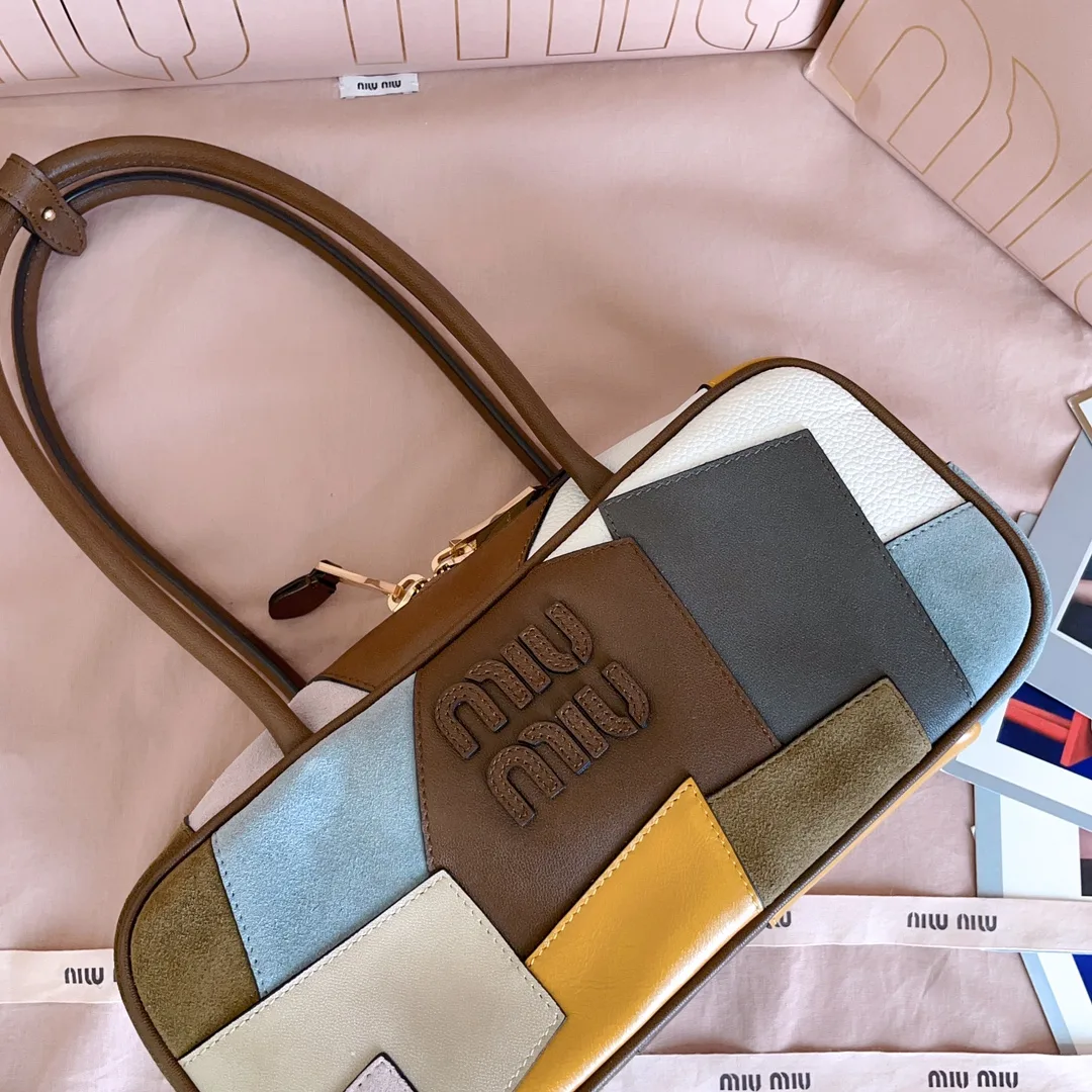 Miu Miu Canvas and Leather Top Handle Bag product photo from LabelPicks