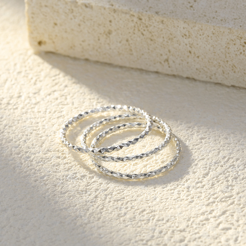 999 pure silver sparkling starry sky ring for women, featuring an intricate floral design, a shimmering sand-like finish, a simple band, and a closed diamond-shaped ring for the index finger