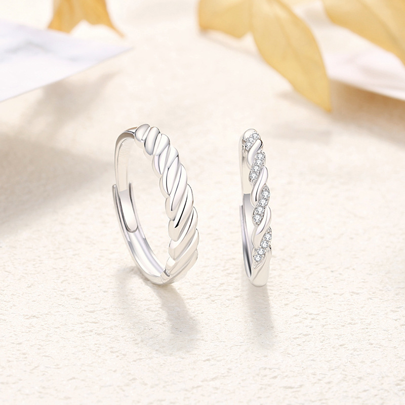 s925 sterling silver, a pair of rings with a romantic and intertwined design, featuring a unique twist pattern, exuding a sophisticated and trendy aesthetic