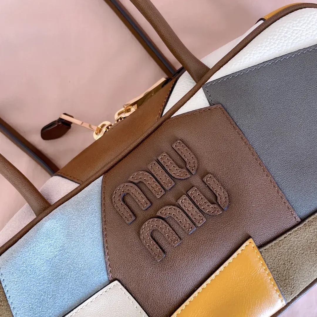 Miu Miu Canvas and Leather Top Handle Bag product photo from LabelPicks