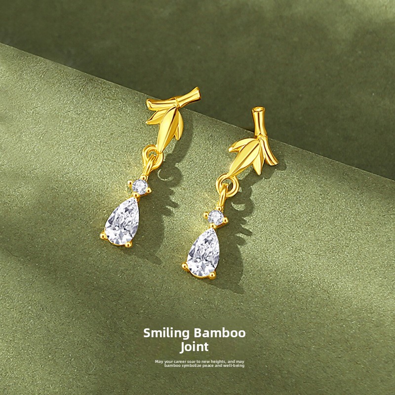 Original bamboo-shaped earrings for women, made of sterling silver with 18K gold plating, featuring a vintage and artistic design in a new Chinese style, with teardrop-shaped cubic zirconia pendants