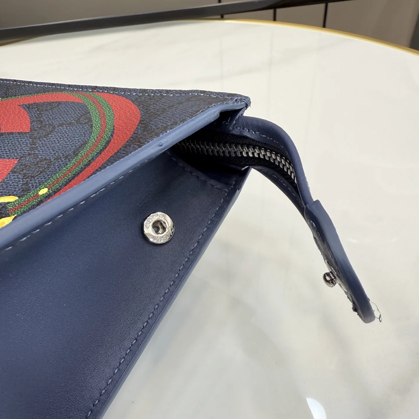 Gucci Navy GG Supreme Canvas Clutch product photo from LabelPicks