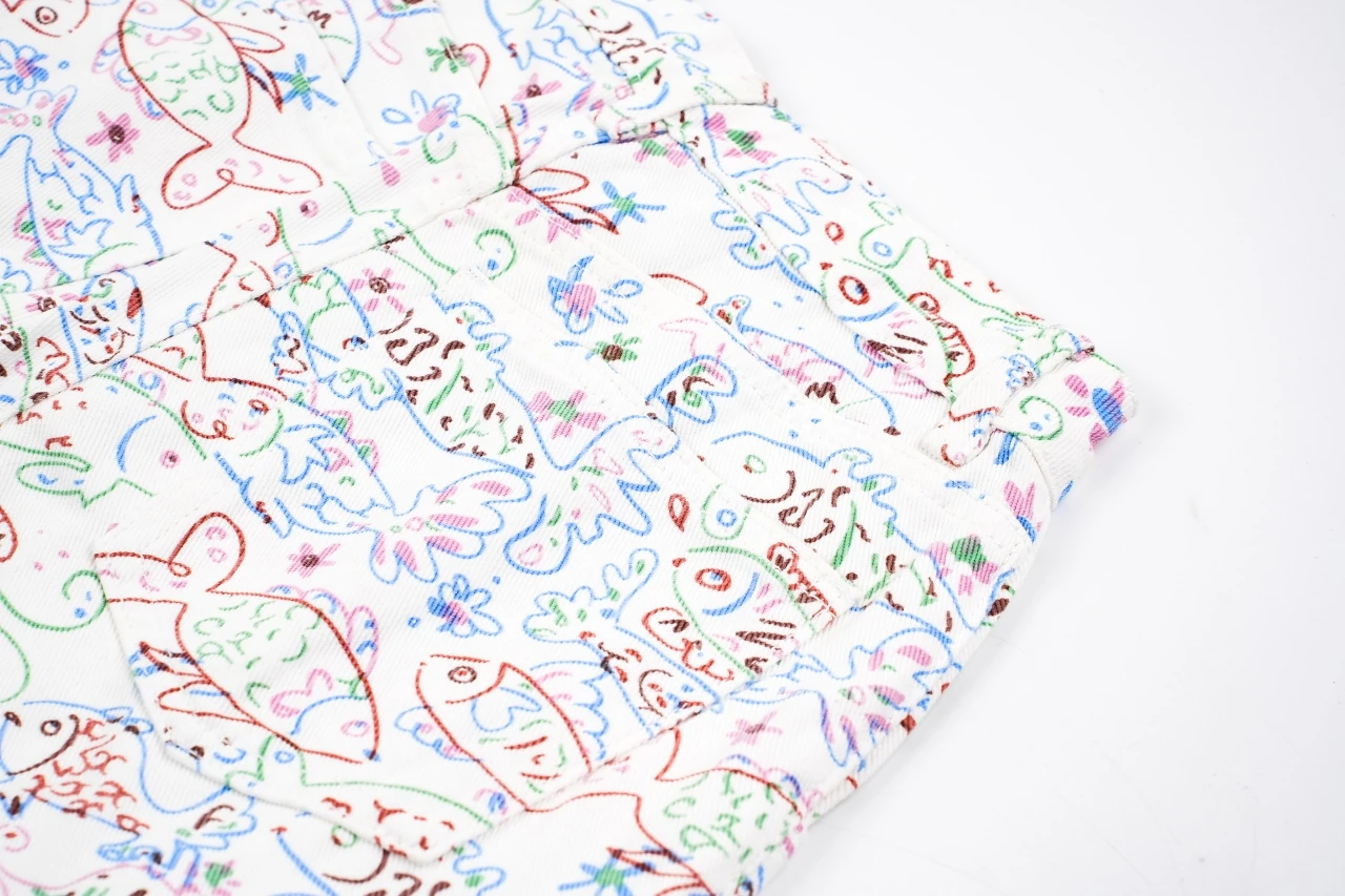 CHANEL Cream White Graffiti Straight-Leg Jeans product photo from LabelPicks