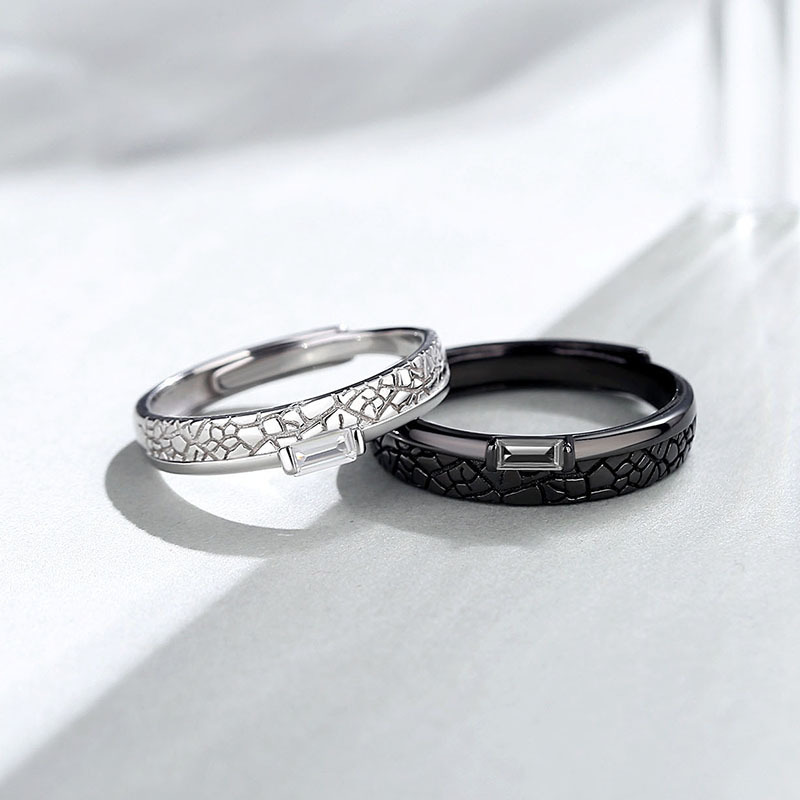 Original design: a pair of rings featuring black and white diamond patterns, perfect for couples with contrasting hair colors, a trendy and unique design inspired by Instagram aesthetics