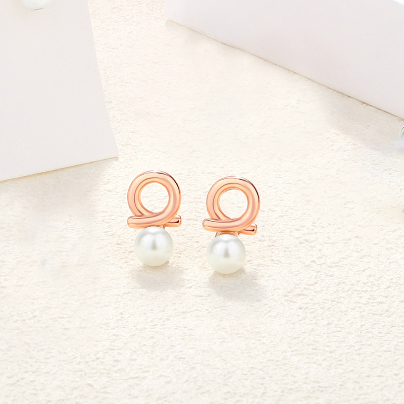 925 sterling silver bow-shaped heart earrings, French-style, chic and elegant, with pearl accents, creating a sophisticated and stylish geometric design