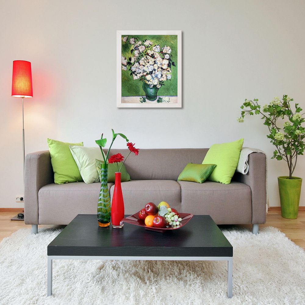 Modern living room decor with a grey sofa, colorful accents, and framed floral wall art.