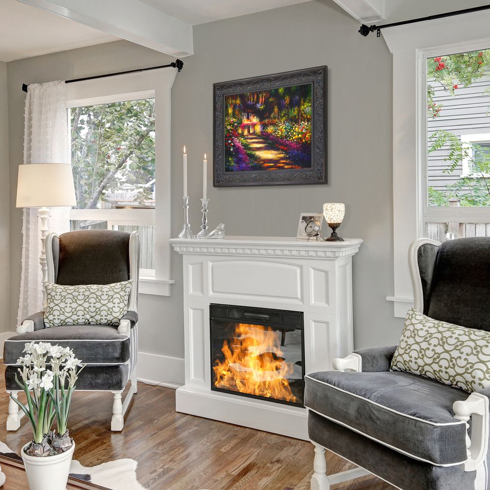 Framed landscape art above fireplace, cozy home decor with gray armchairs and floral wall painting, living room wall decoration ideas.