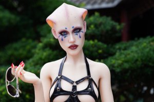 Alien fantasy sex doll with bold features and high-fashion elements