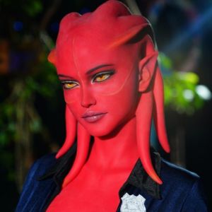 Red-skinned real-size alien doll with fierce yellow eyes and sci-fi officer style