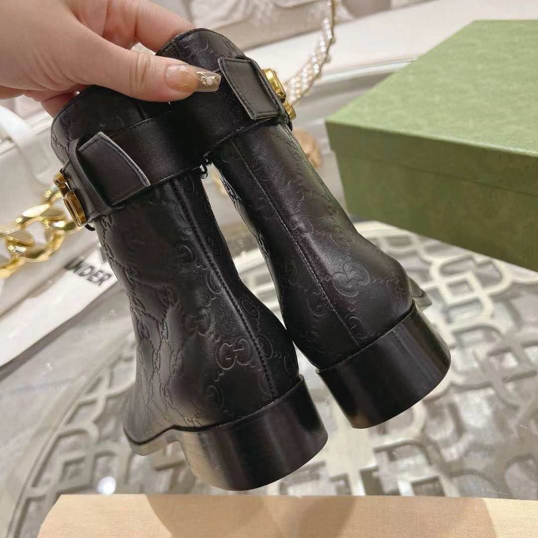 Gucci embossed boots