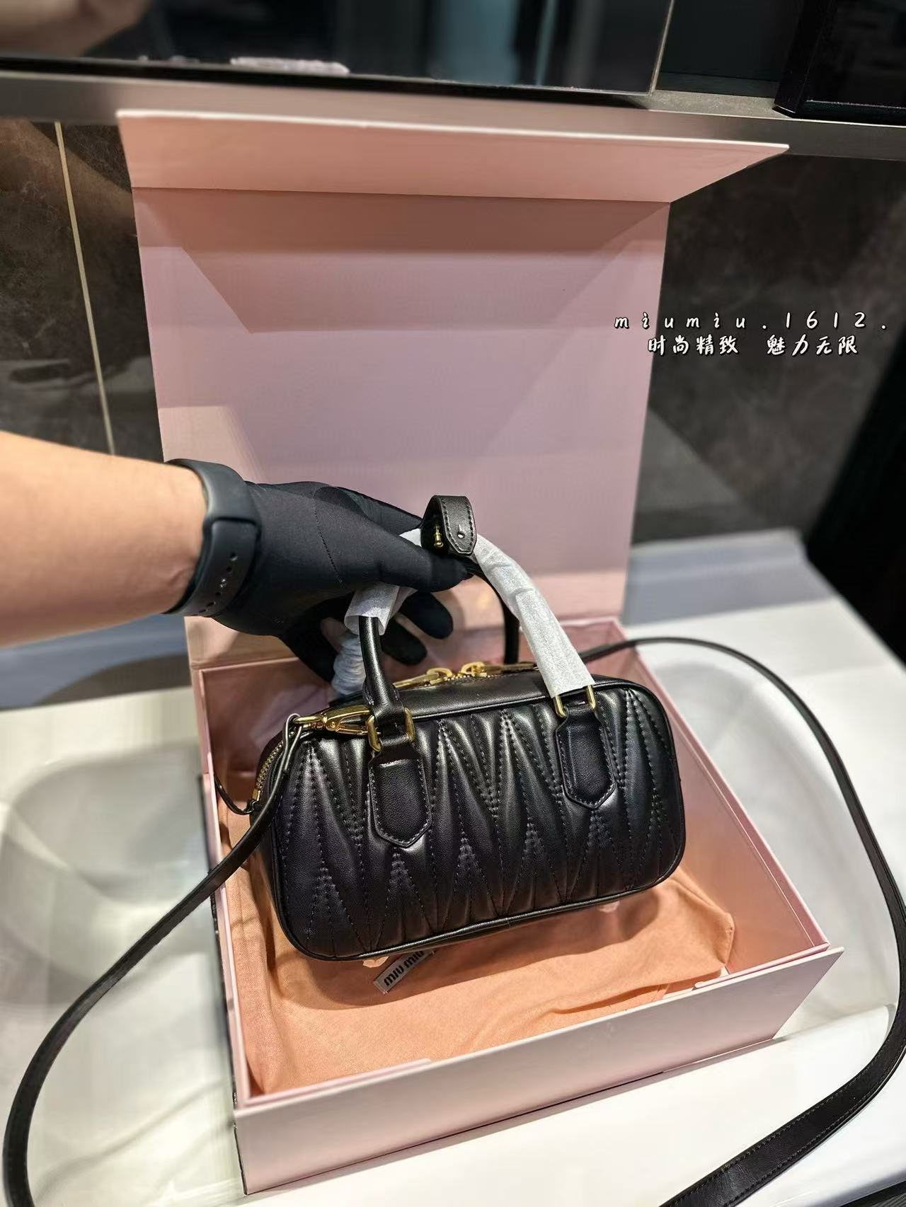 Miumiu Aracdie pleated bowling bag