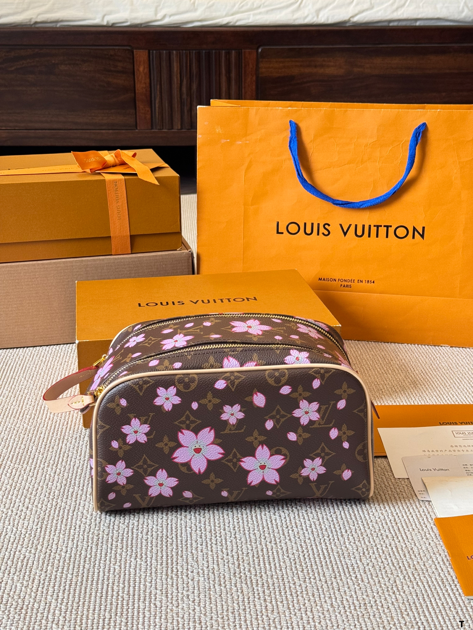 LV hand-held cosmetic bag