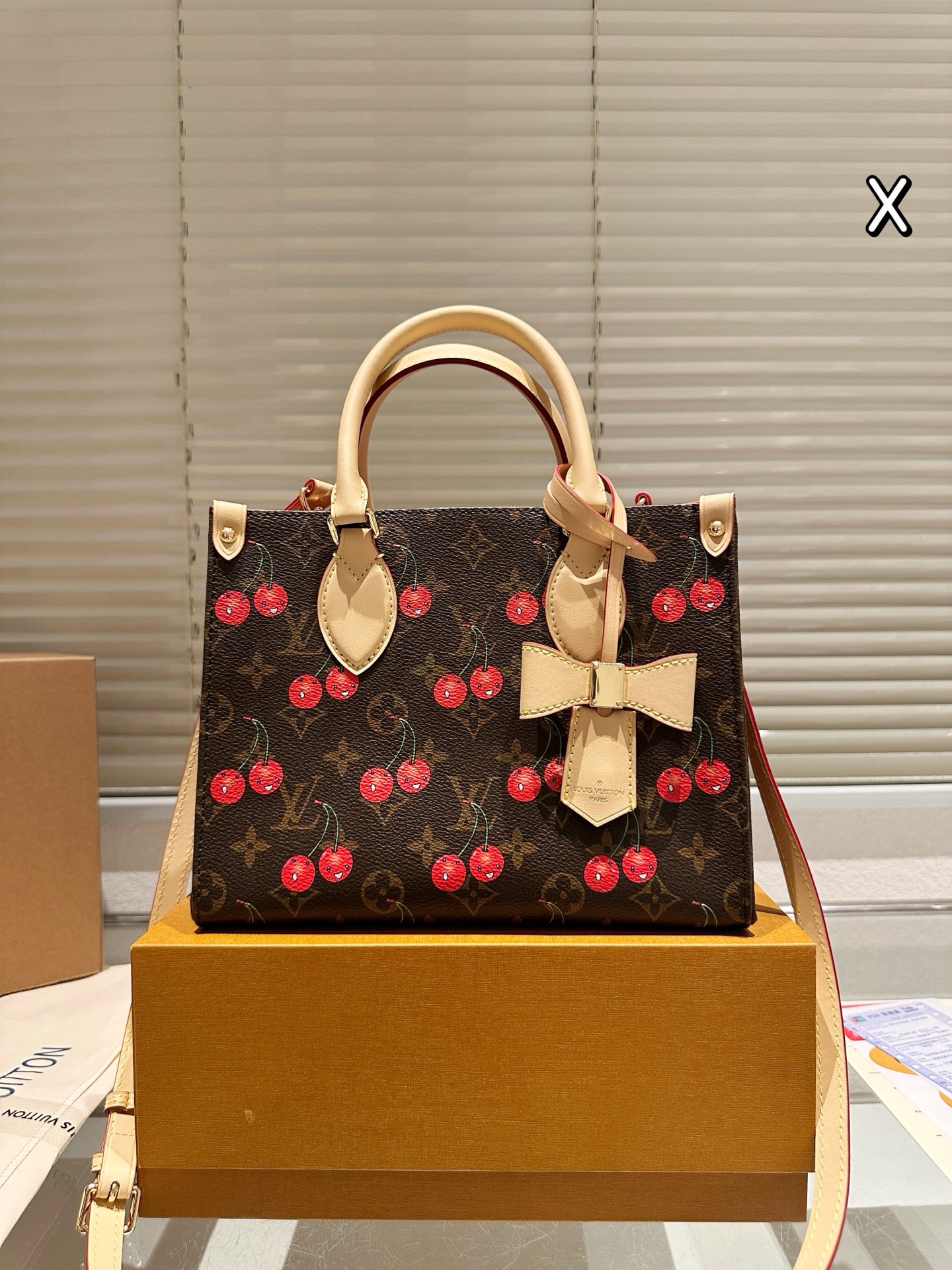 LV Onthego cherry print bag