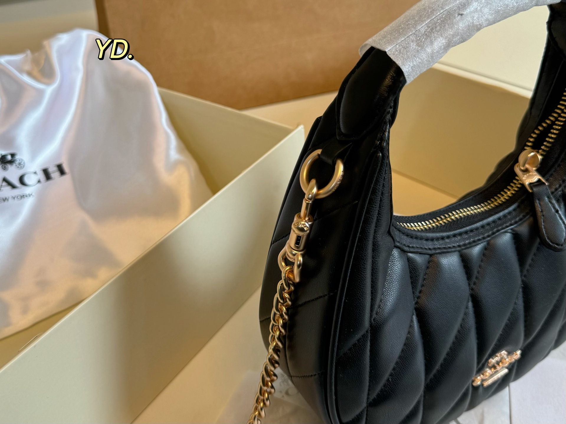 Coach's new Carmen mini crescent armpit bag