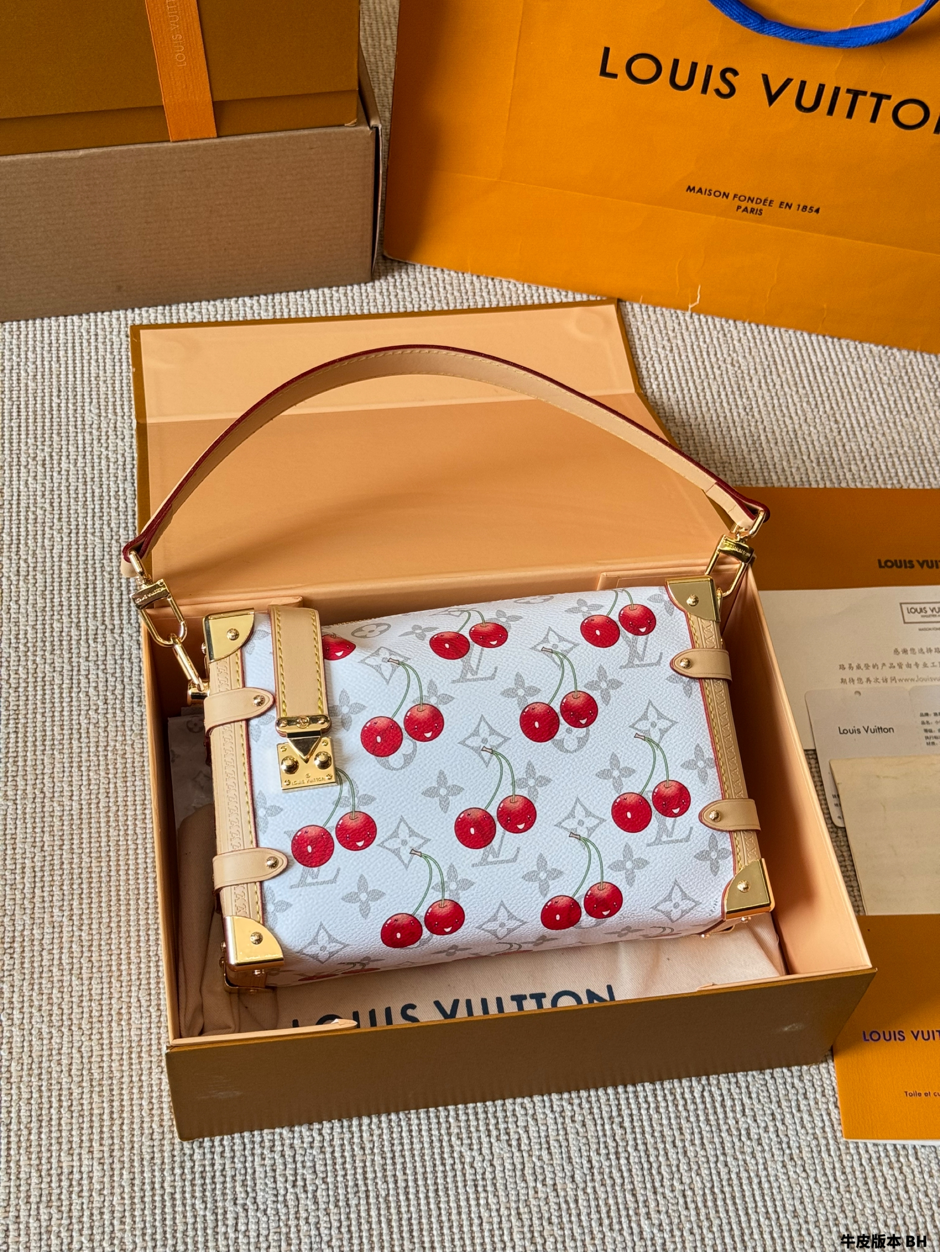 LV Side trunk cherry bag