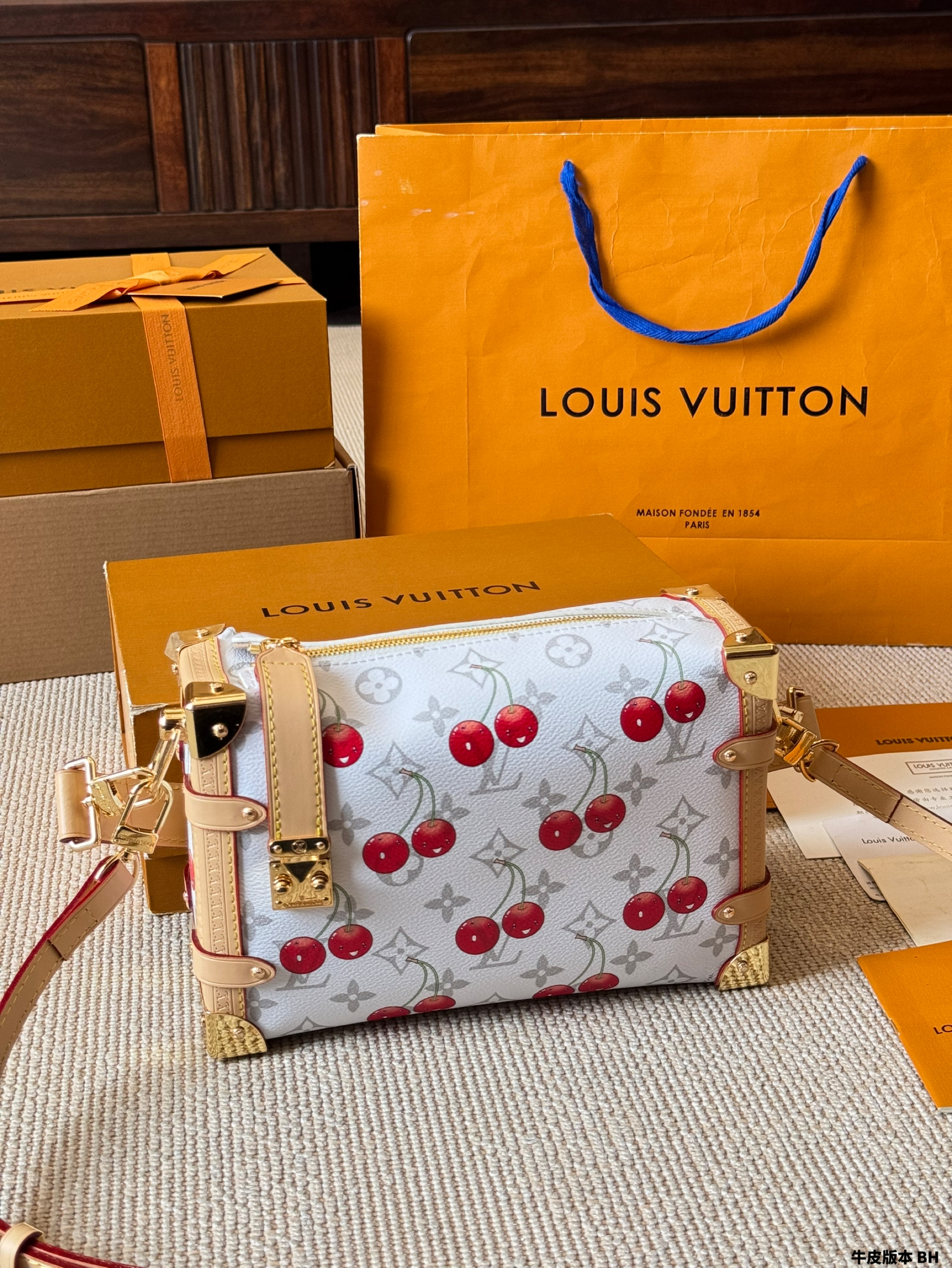 LV Side trunk cherry bag