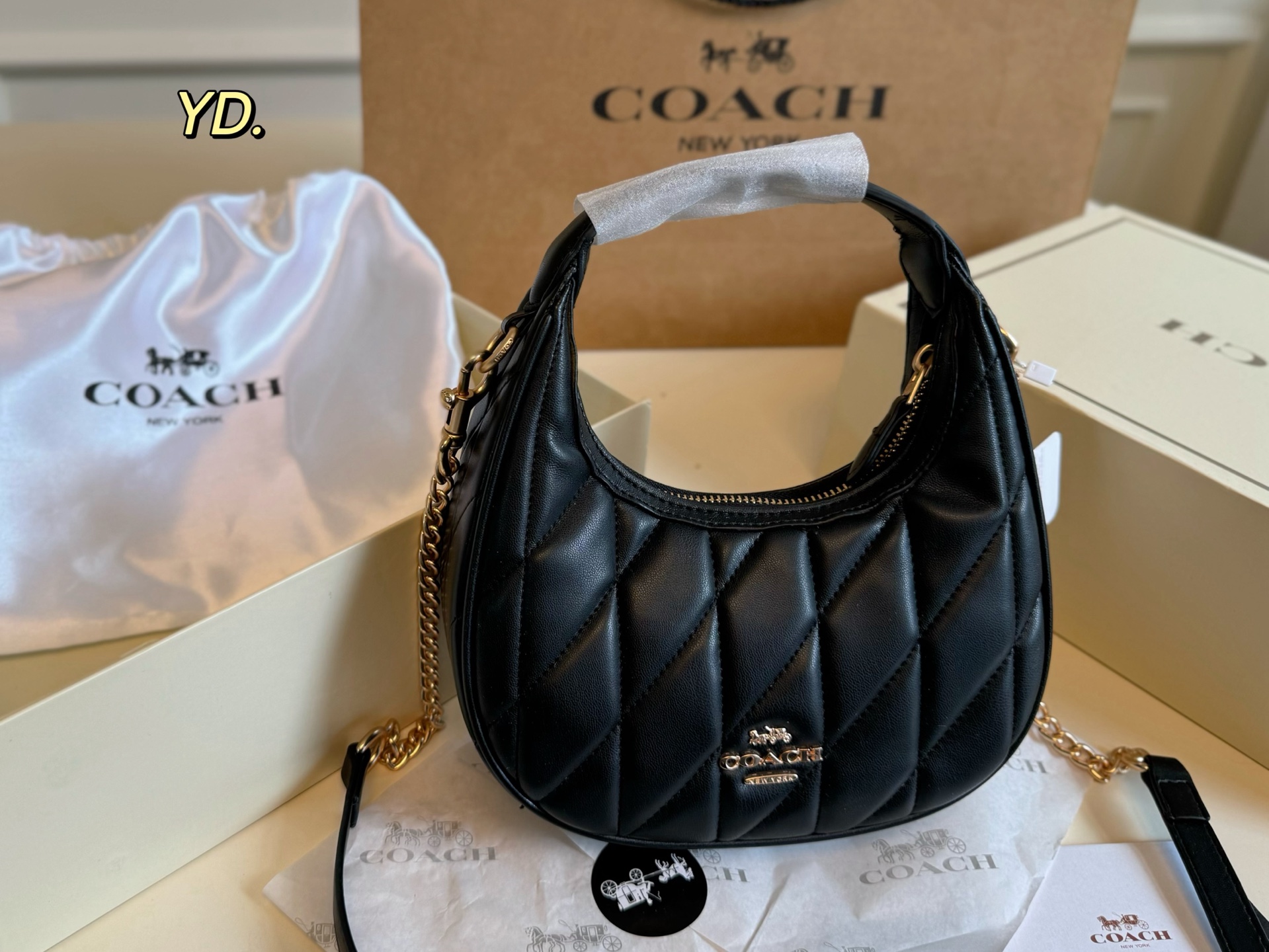 Coach's new Carmen mini crescent armpit bag