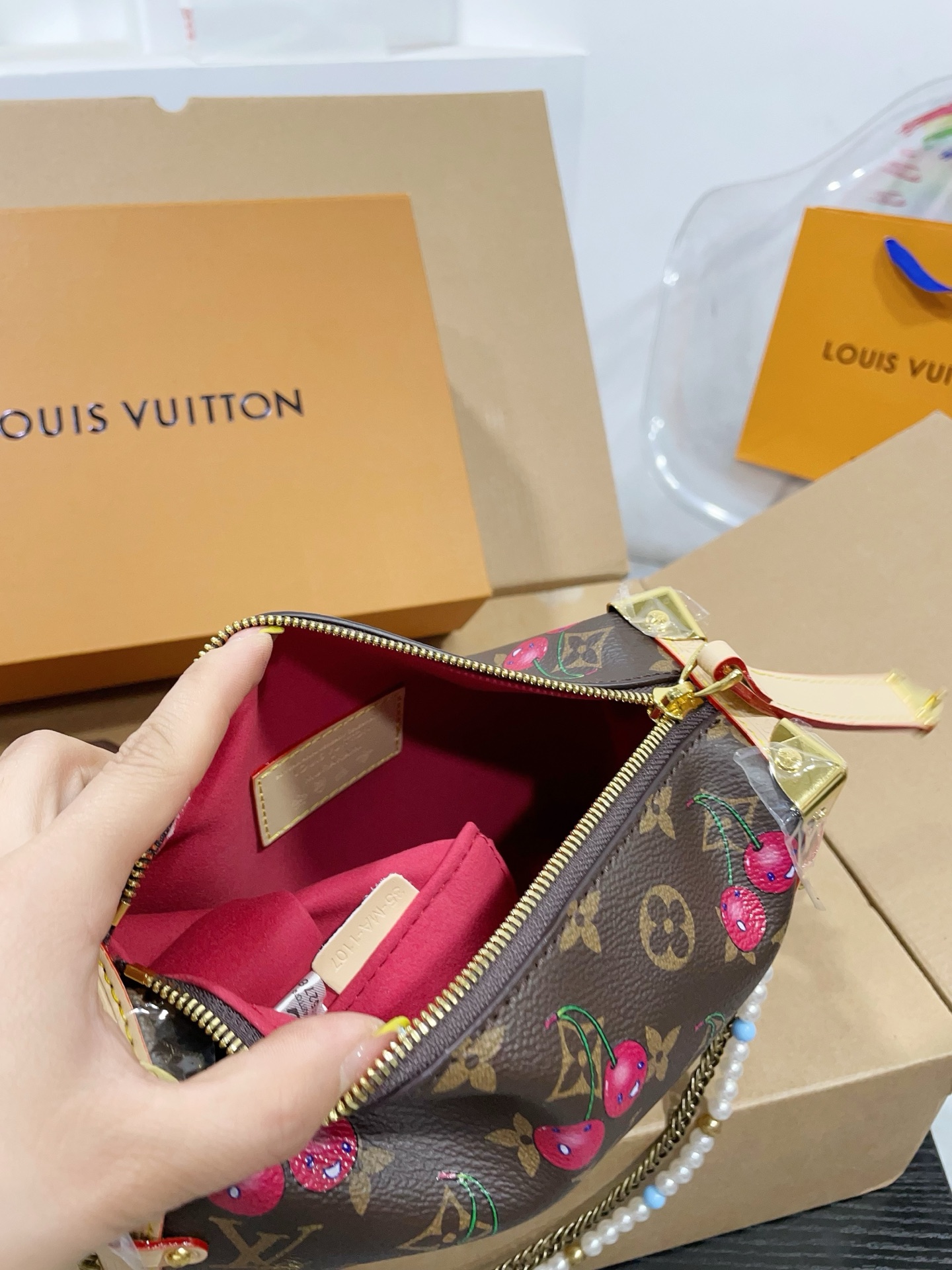 LV Side trunk cherry bag