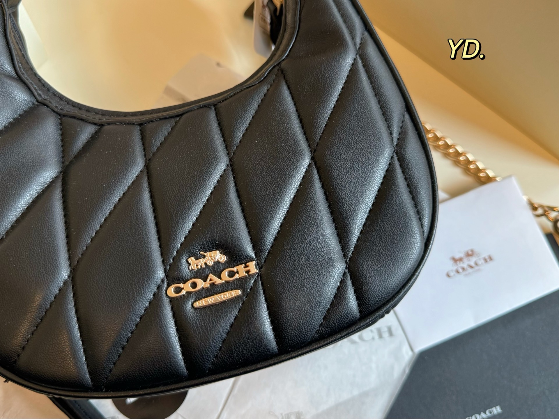 Coach's new Carmen mini crescent armpit bag