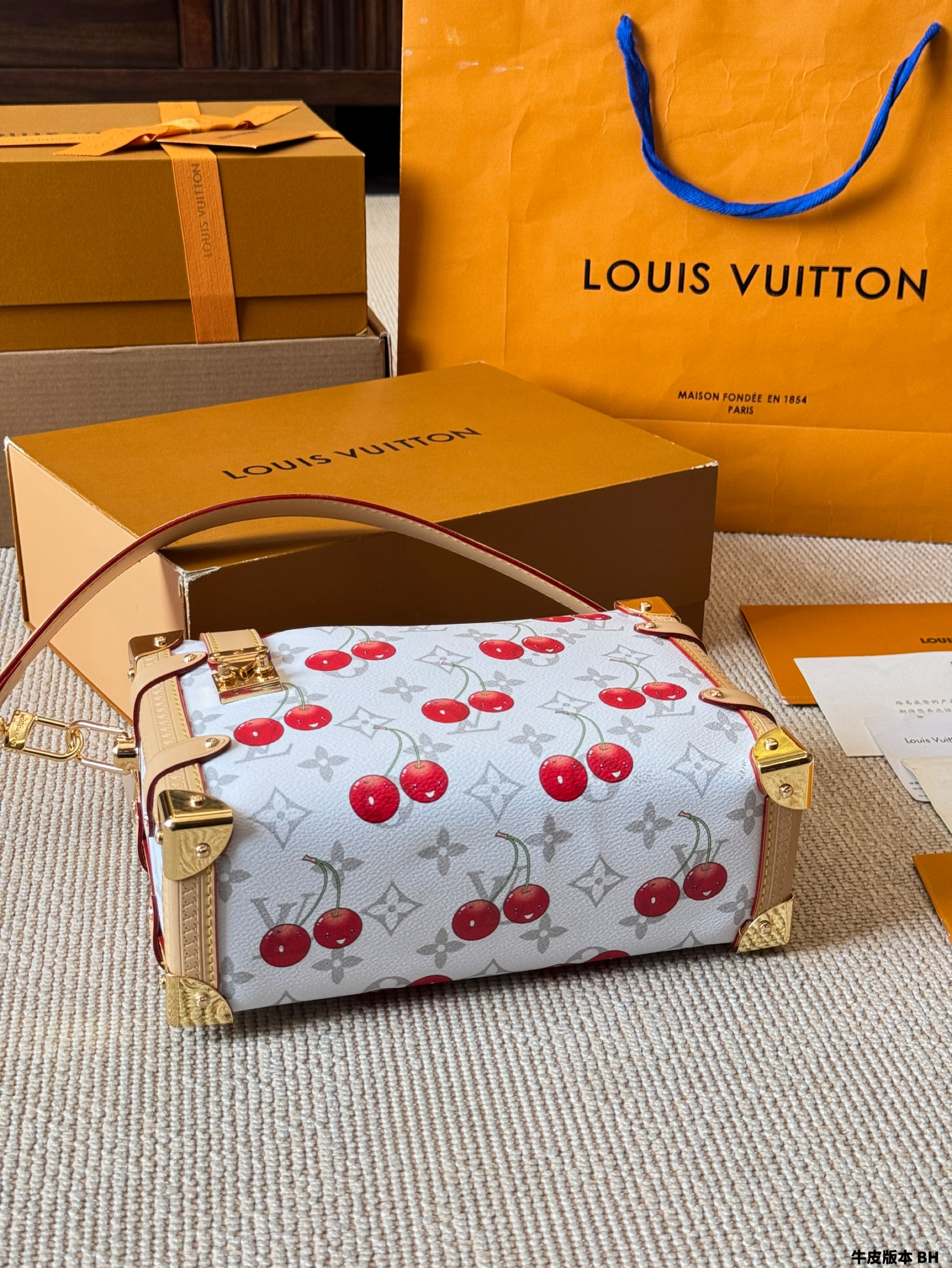 LV Side trunk cherry bag