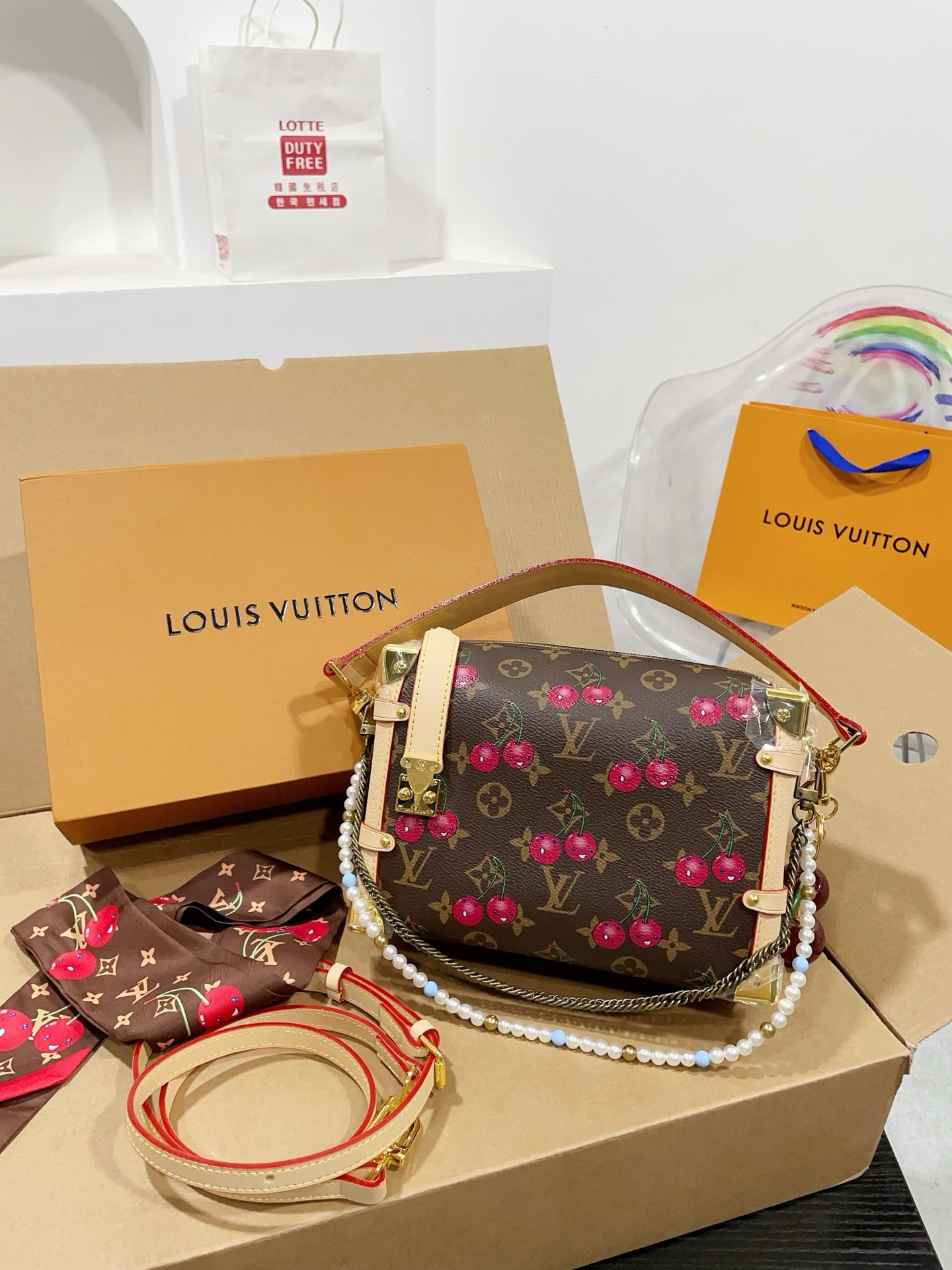 LV Side trunk cherry bag