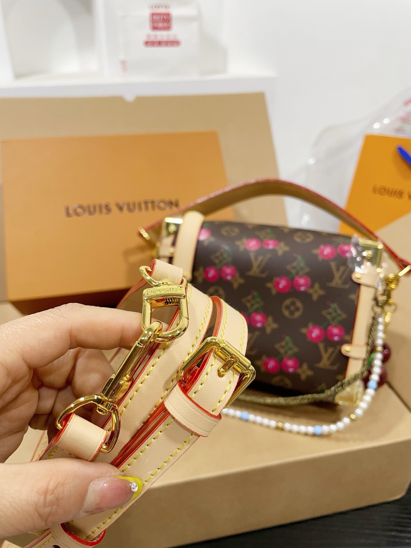 LV Side trunk cherry bag