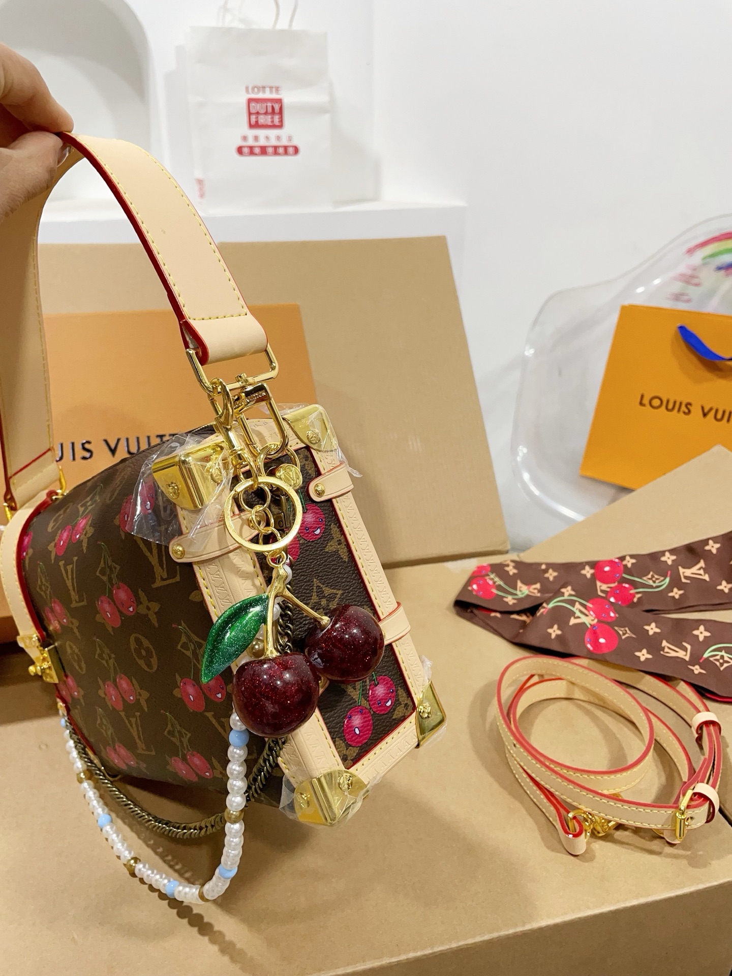 LV Side trunk cherry bag