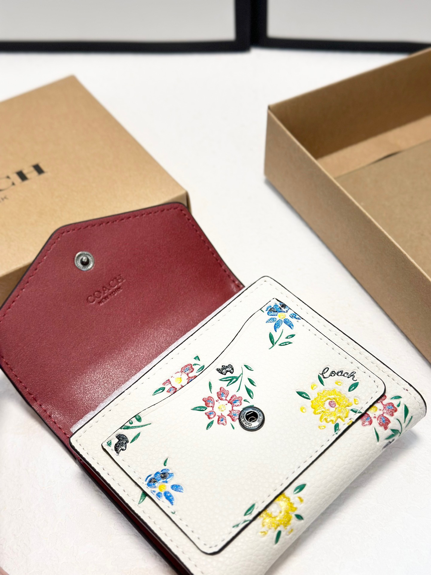 Coach printed tri-fold short wallet