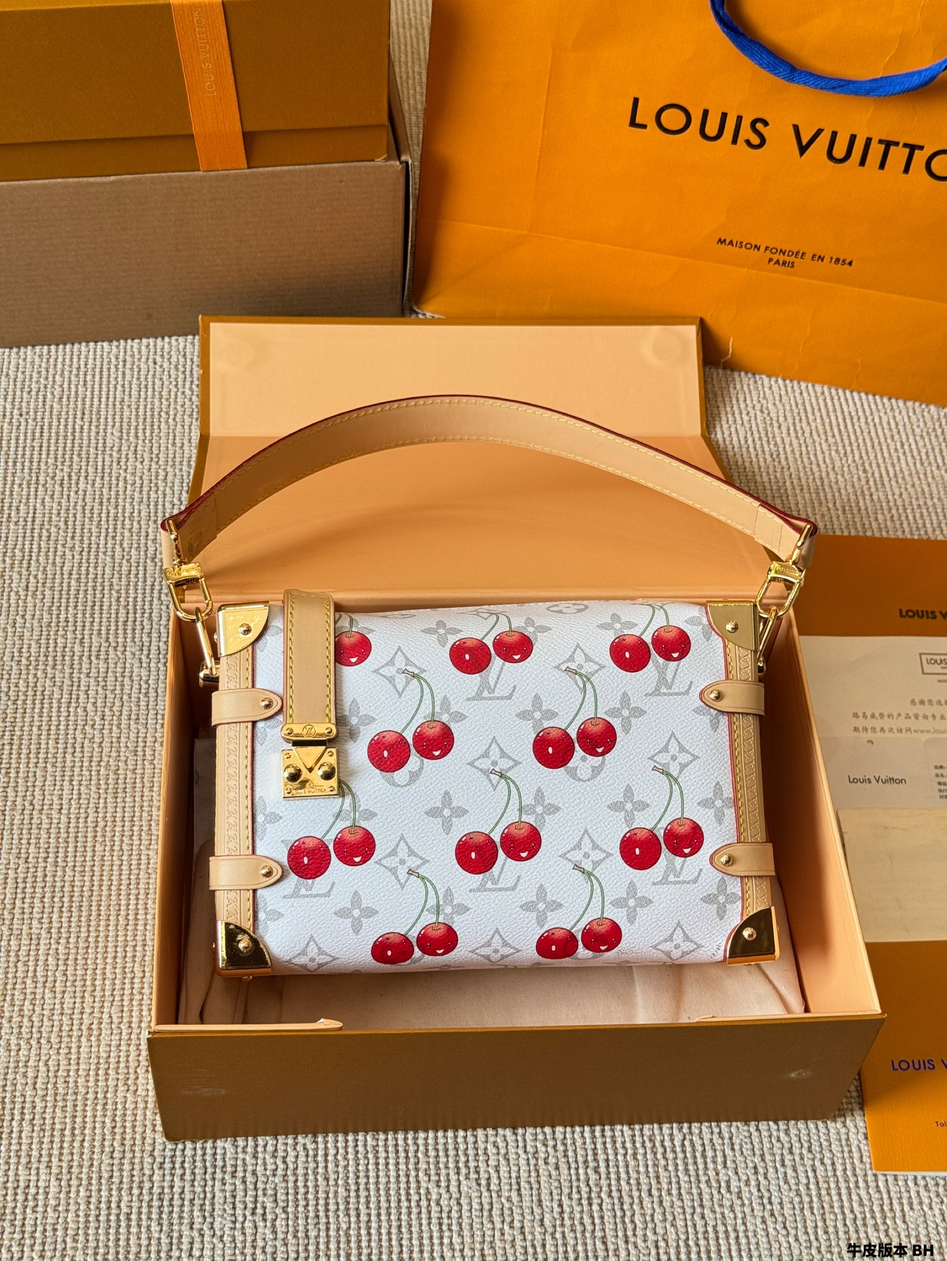 LV Side trunk cherry bag