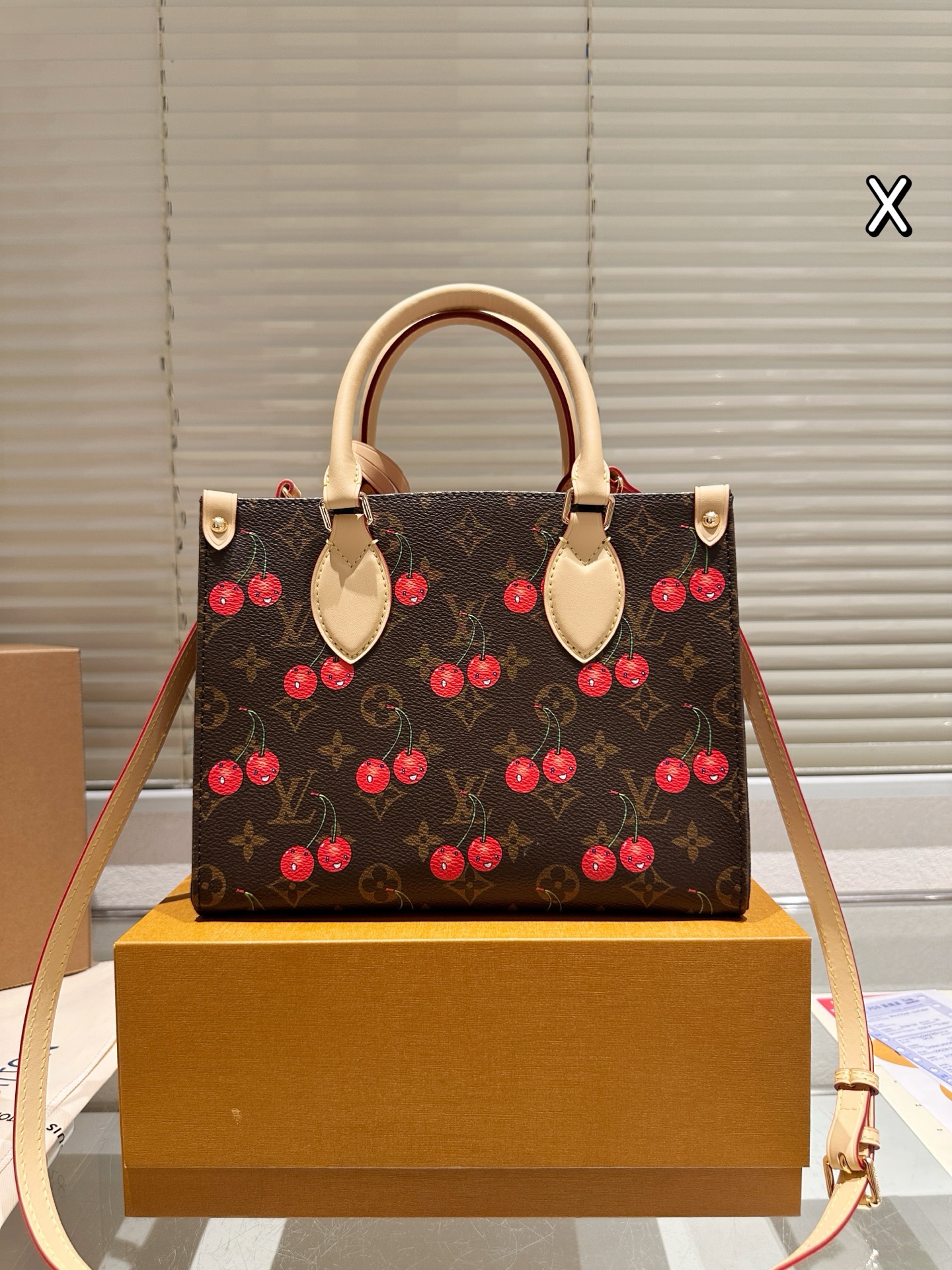 LV Onthego cherry print bag