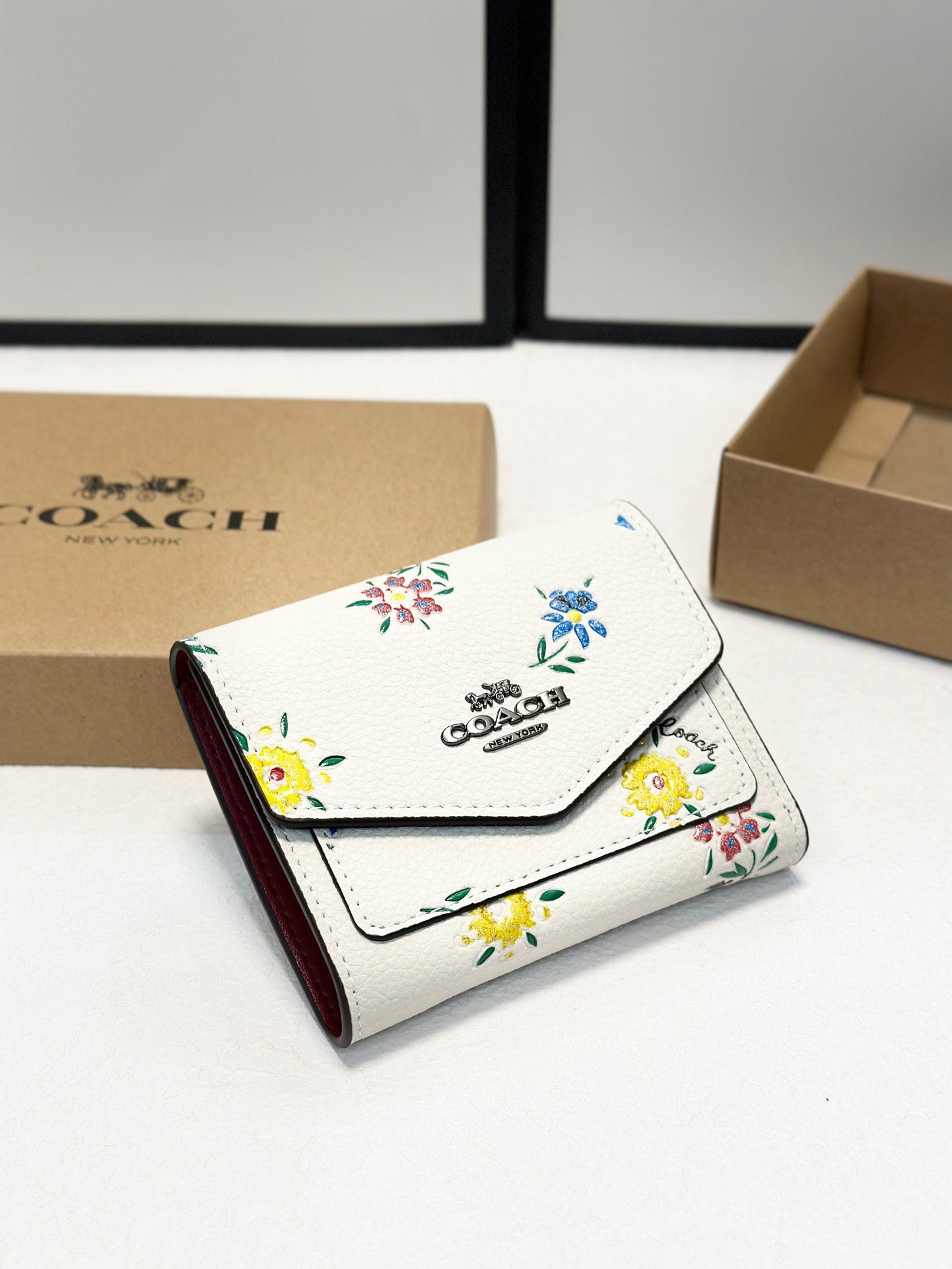 Coach printed tri-fold short wallet