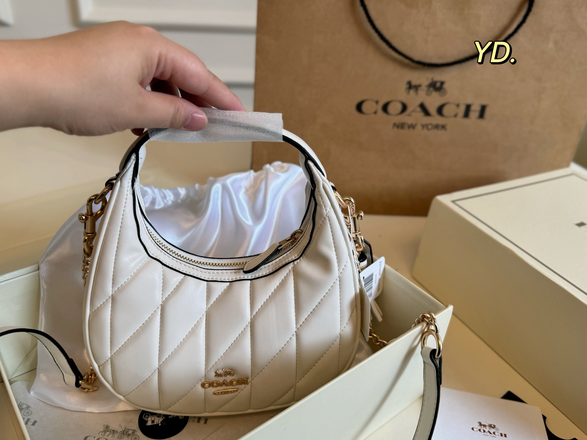 Coach's new Carmen mini crescent armpit bag