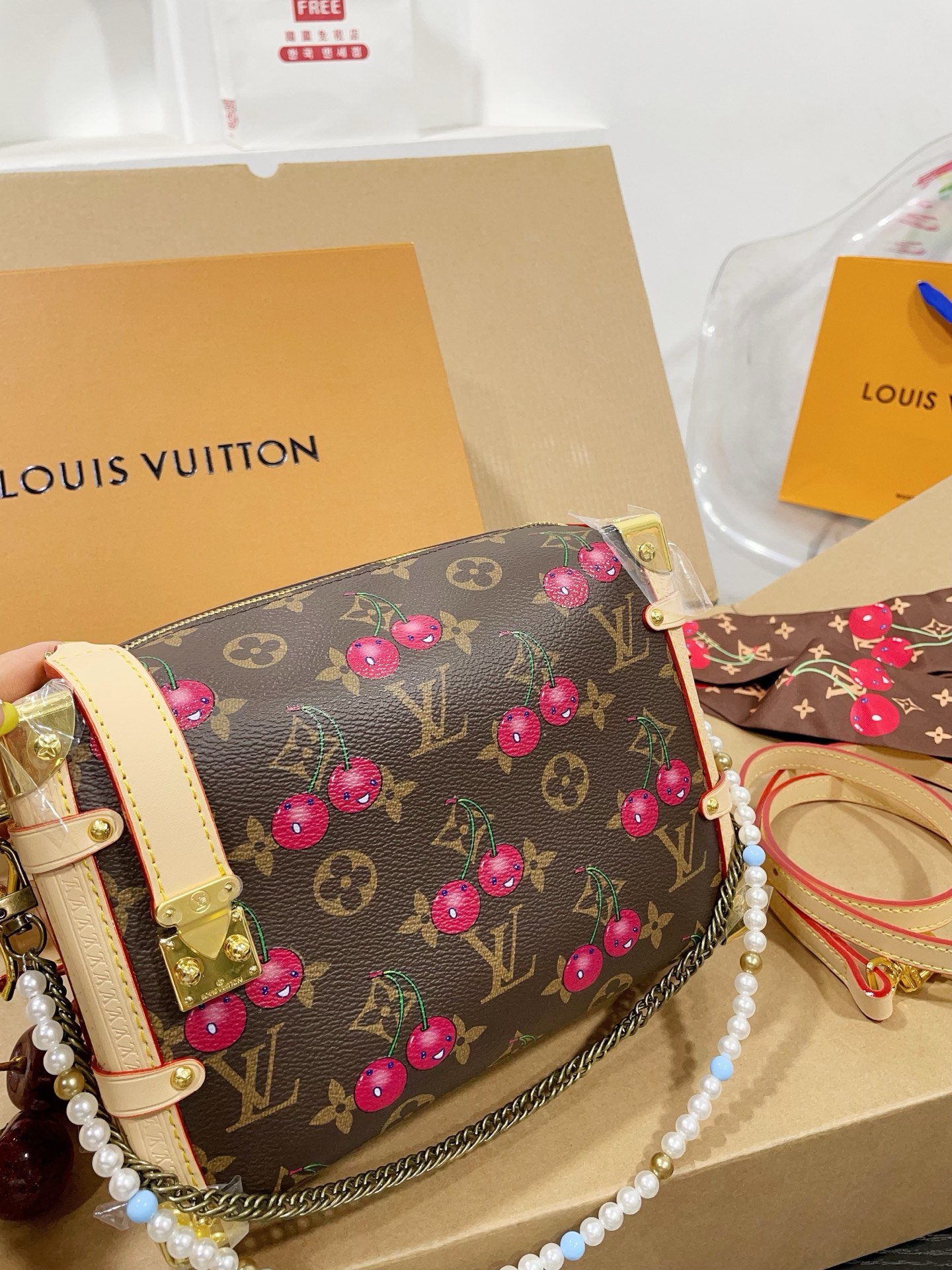 LV Side trunk cherry bag