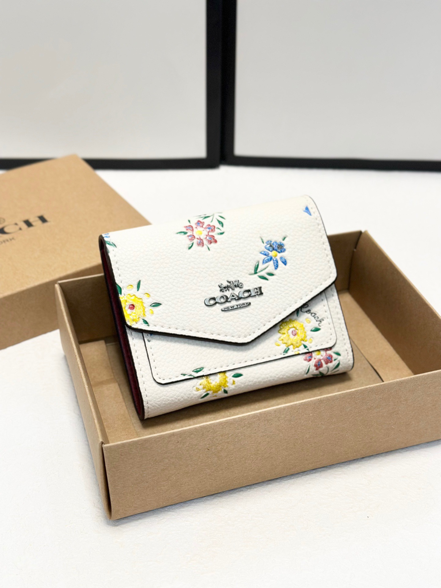 Coach printed tri-fold short wallet