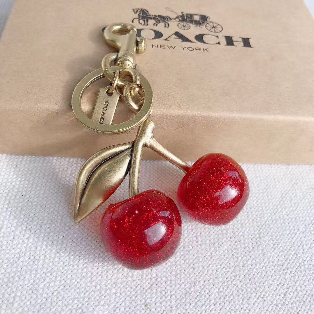 Coach cherry keychain