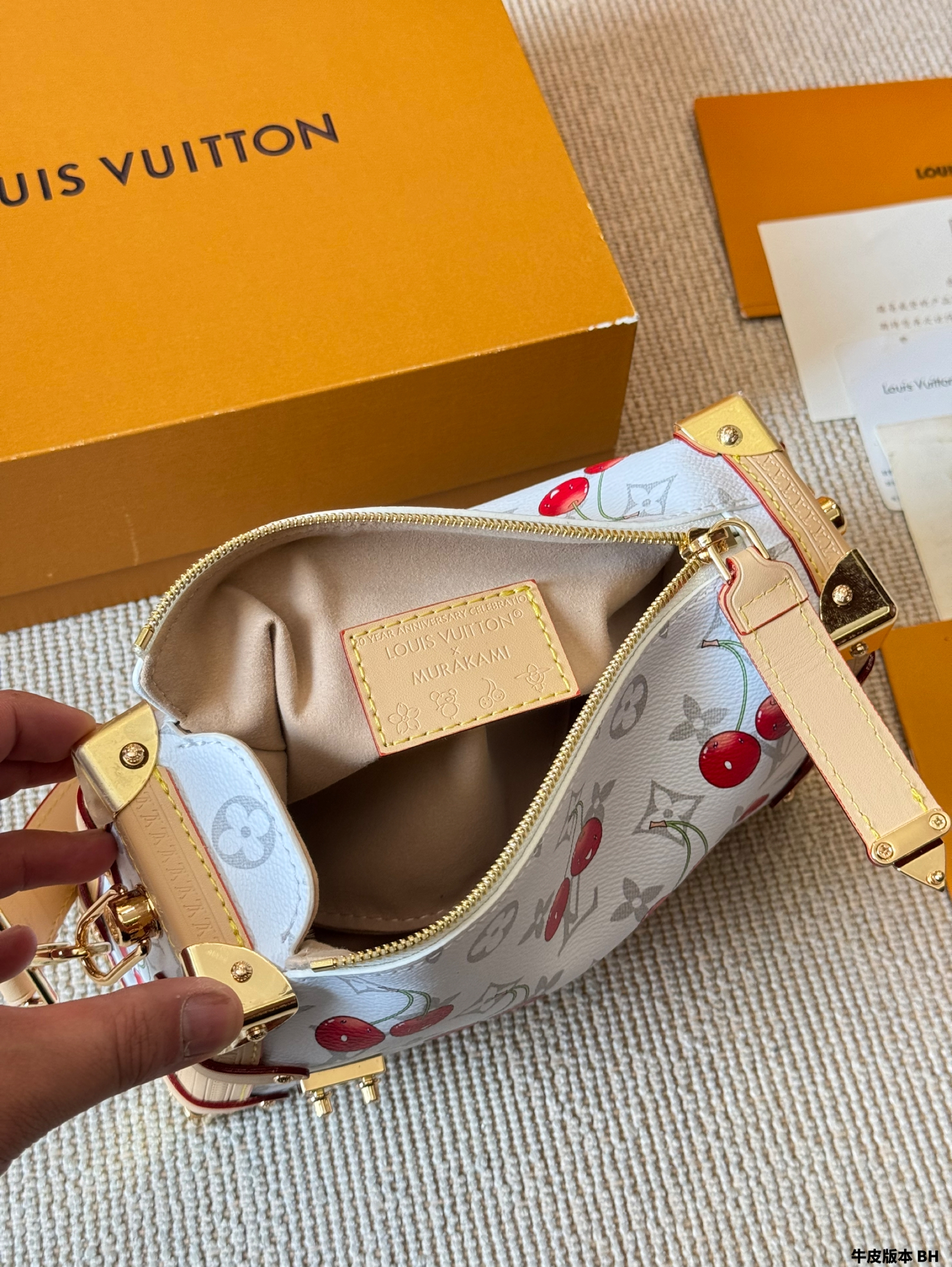 LV Side trunk cherry bag