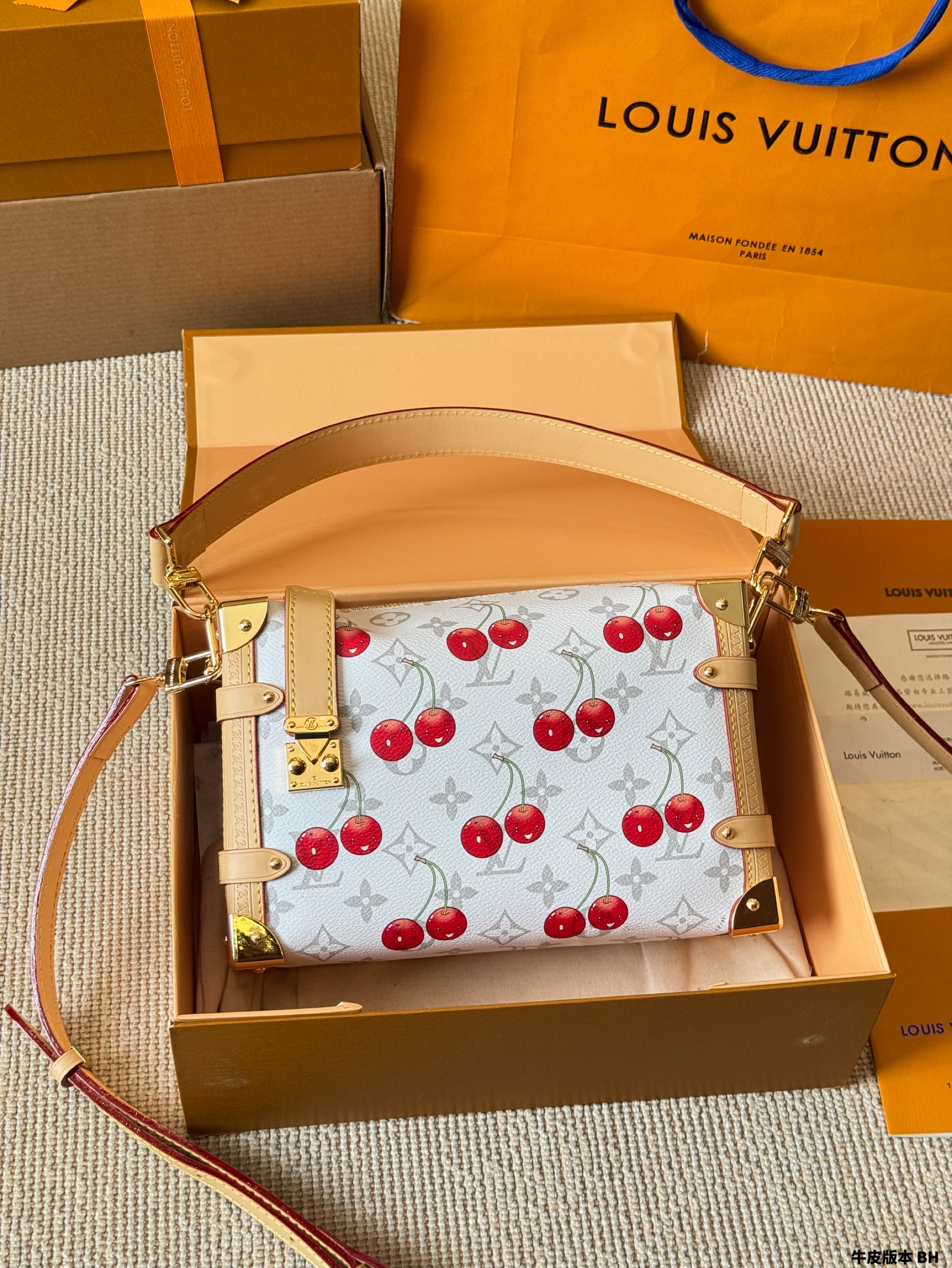 LV Side trunk cherry bag