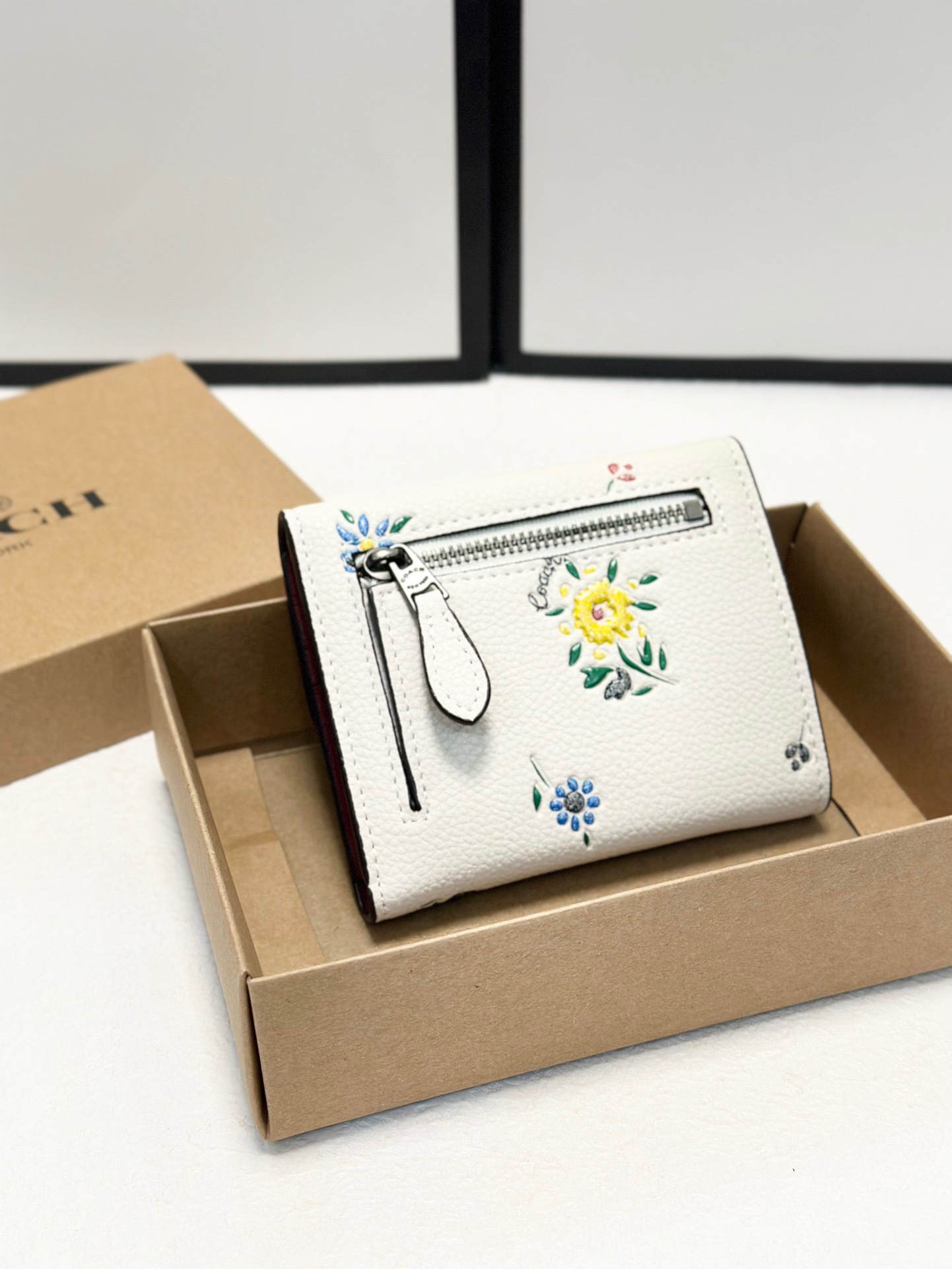 Coach printed tri-fold short wallet