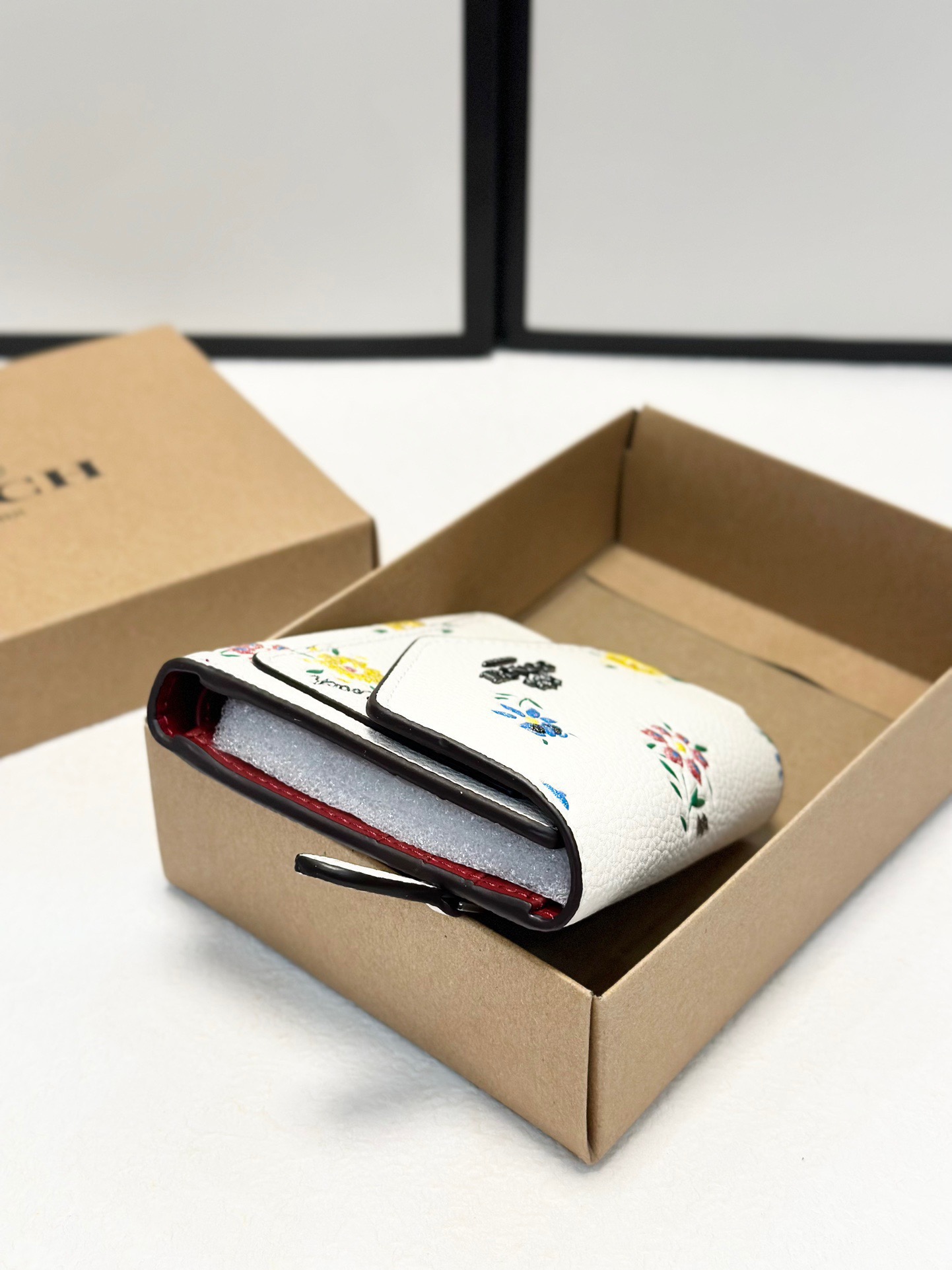 Coach printed tri-fold short wallet