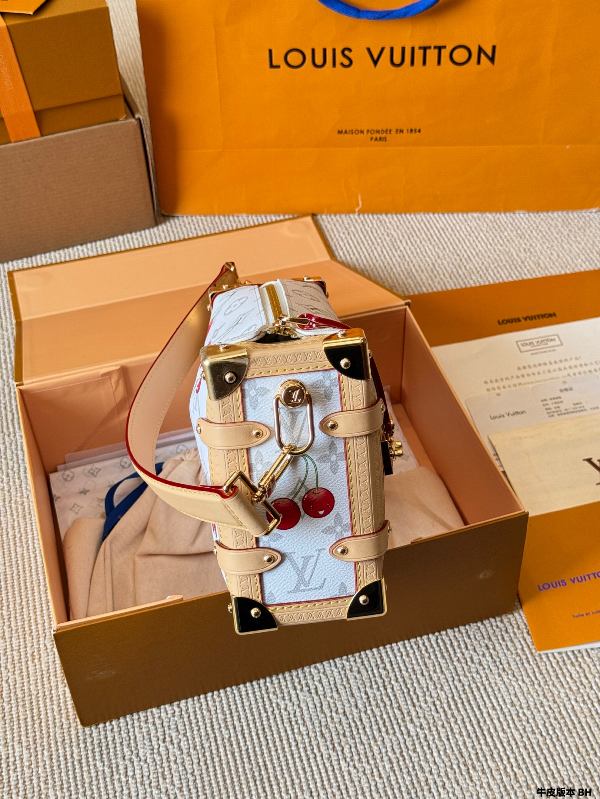 LV Side trunk cherry bag